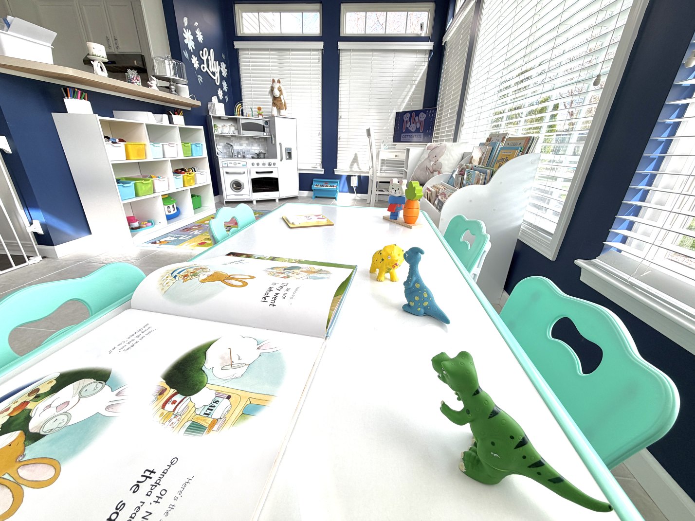 Preschool table at Cottontail Childcare with books and toys ready for learning activities